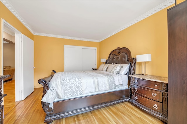 100-25 Queens Blvd Unit 6E, Forest Hills, NY 11375 - bedroom with light wood-style flooring, a closet, and ornamental molding