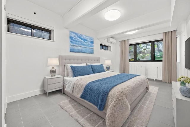 242 S 1st St Unit 1D, Brooklyn, NY 11211 - bedroom with an AC wall unit, radiator heating unit, light tile patterned floors, beamed ceiling, and baseboards