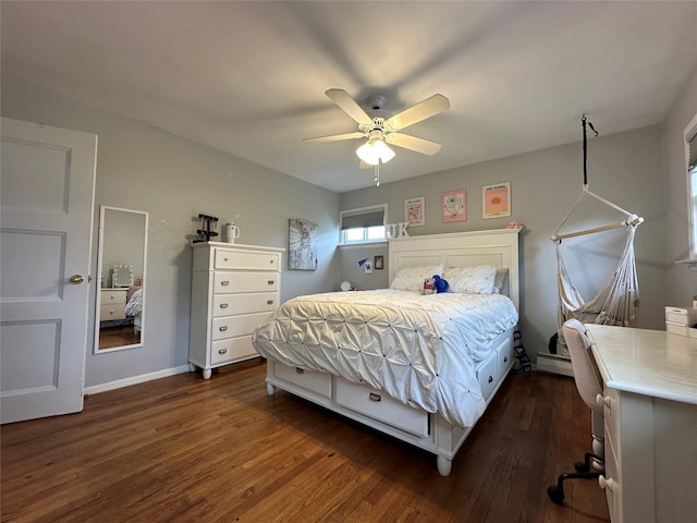 bedroom with dark wood finished floors, a baseboard radiator, ceiling fan, and baseboards