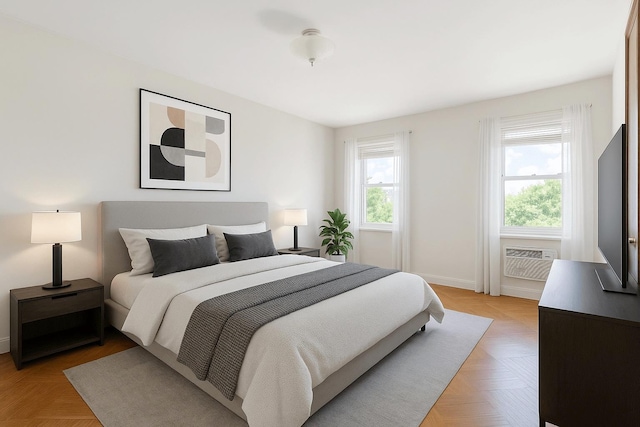 bedroom featuring multiple windows and baseboards