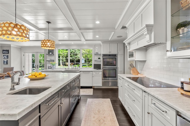 kitchen with a sink, black electric cooktop, recessed lighting, dark wood-style flooring, and healthy amount of natural light