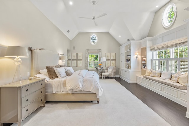 bedroom with wood finished floors, multiple windows, ceiling fan, high vaulted ceiling, and recessed lighting