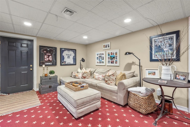 living room with carpet and baseboards