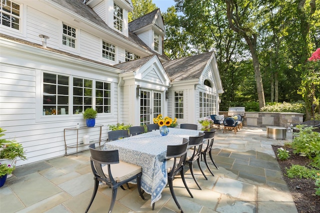 view of patio featuring outdoor dining area
