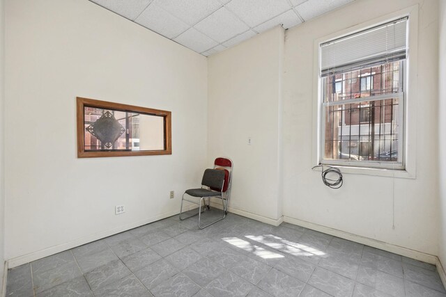 42-06 66th St, Woodside, NY 11377 - unfurnished room with a drop ceiling and baseboards
