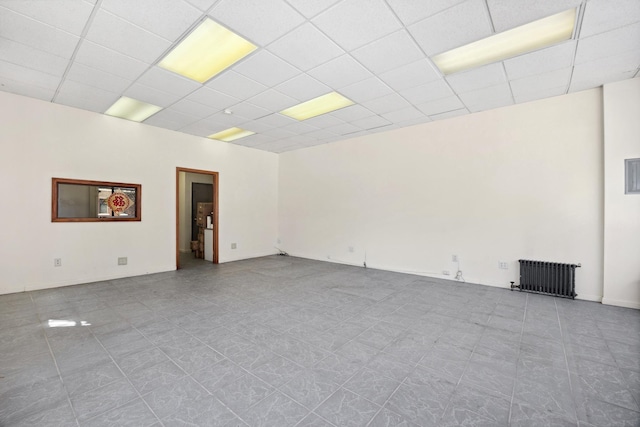 42-06 66th St, Woodside, NY 11377 - spare room with radiator and a drop ceiling