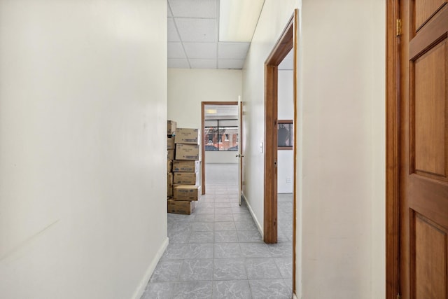 42-06 66th St, Woodside, NY 11377 - hallway with a drop ceiling, baseboards, and light tile patterned floors