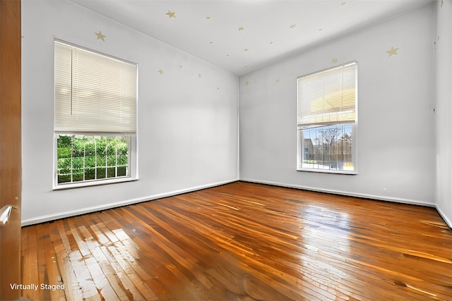 42-06 66th St, Woodside, NY 11377 - empty room with hardwood / wood-style floors, baseboards, and lofted ceiling
