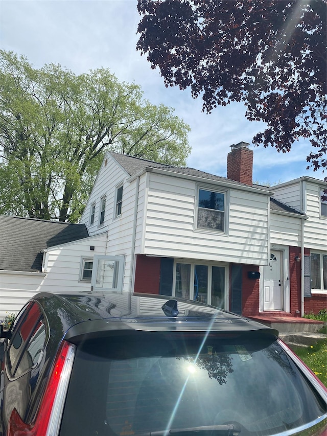 321 Niagara Falls Blvd, Call Listing Agent, NY 14226 - view of front of house featuring a chimney and brick siding