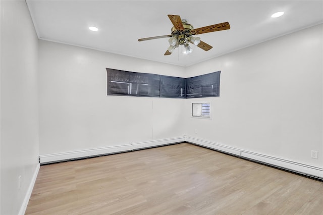 empty room featuring wood finished floors, a ceiling fan, recessed lighting, and baseboards