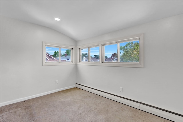 empty room featuring baseboard heating, carpet floors, baseboards, recessed lighting, and vaulted ceiling