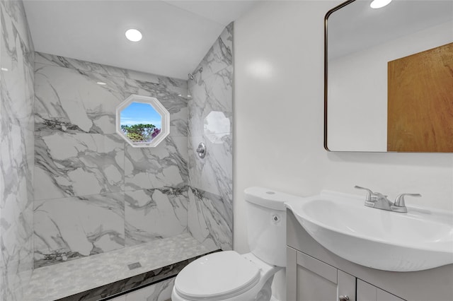 full bathroom with vanity, toilet, a marble finish shower, and recessed lighting