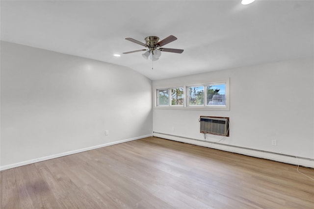 unfurnished room featuring a wall unit AC, ceiling fan, wood finished floors, recessed lighting, and baseboards
