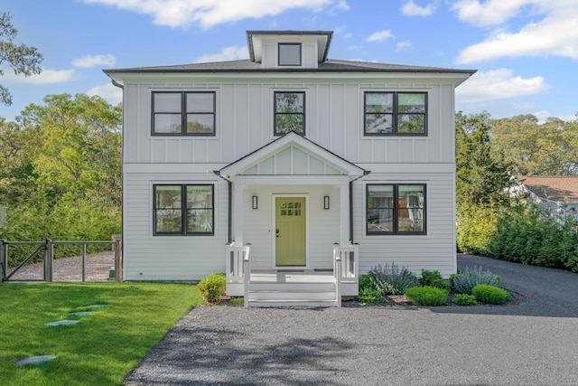 128 Priscilla Ave, Flanders, NY 11901 - view of front of house featuring board and batten siding and a gate