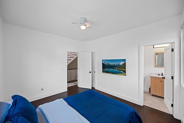 128 Priscilla Ave, Flanders, NY 11901 - bedroom with wood finished floors, baseboards, ensuite bath, and a ceiling fan
