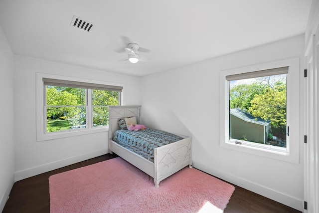 128 Priscilla Ave, Flanders, NY 11901 - bedroom with multiple windows, baseboards, and wood finished floors