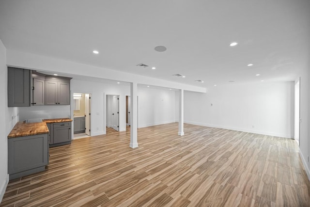 128 Priscilla Ave, Flanders, NY 11901 - basement with light wood-style flooring, recessed lighting, and baseboards