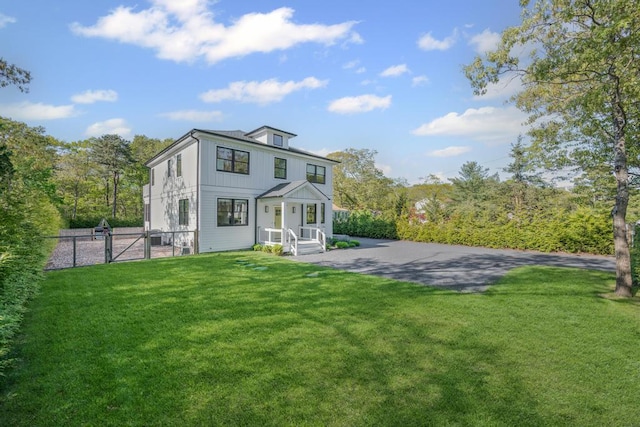 128 Priscilla Ave, Flanders, NY 11901 - back of house featuring a gate and board and batten siding