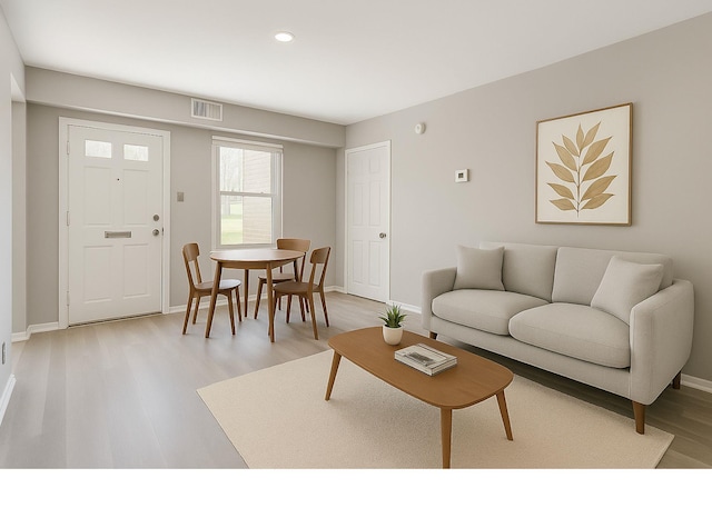 35 Navajo Ct Unit 35, Coram, NY 11727 - living room featuring light wood finished floors, baseboards, and recessed lighting