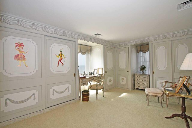 living area with light carpet