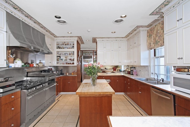 2 Wallis Ln, Nissequogue, NY 11780 - kitchen with stainless steel appliances, a sink, light tile patterned floors, open shelves, and white cabinets