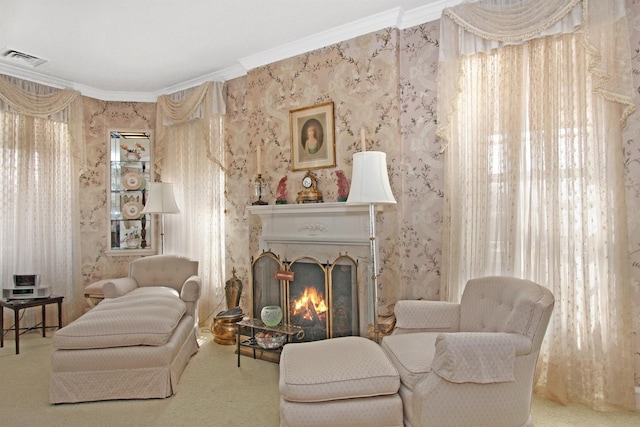 2 Wallis Ln, Nissequogue, NY 11780 - sitting room with wallpapered walls, ornamental molding, carpet, and a lit fireplace
