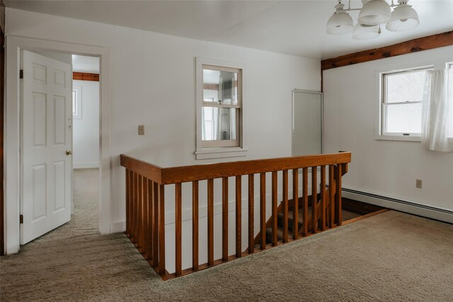 26 Beckys Hill Rd, Hurleyville, NY 12747 - corridor with an upstairs landing, a chandelier, a baseboard heating unit, and carpet flooring