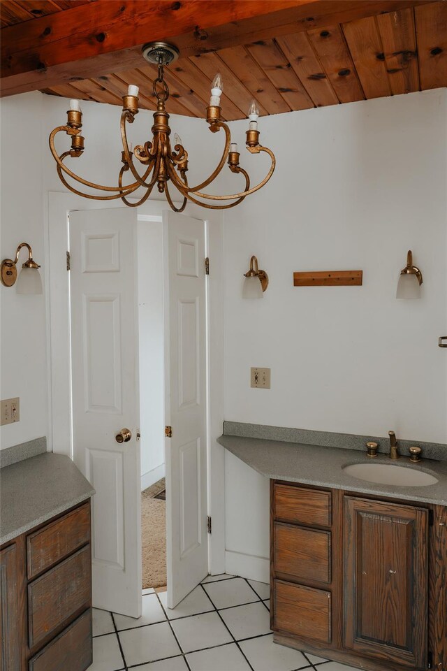 26 Beckys Hill Rd, Hurleyville, NY 12747 - bathroom with a sink, a chandelier, and tile patterned flooring