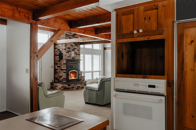 26 Beckys Hill Rd, Hurleyville, NY 12747 - living room with wooden ceiling, carpet, beamed ceiling, and a fireplace