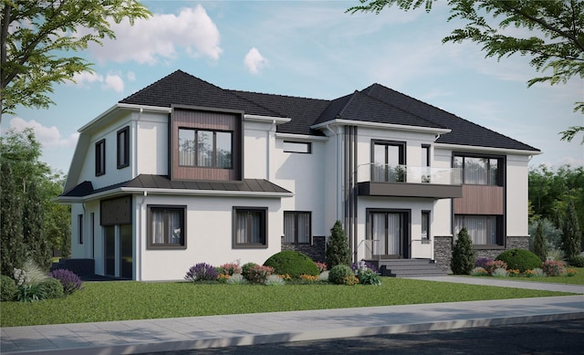 view of front of home with a balcony, stucco siding, a front yard, and stone siding