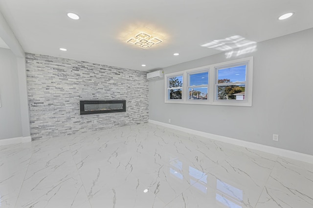 52 State St, Valley Stream, NY 11580 - unfurnished living room featuring a wall mounted AC, a tile fireplace, baseboards, recessed lighting, and marble finish flooring