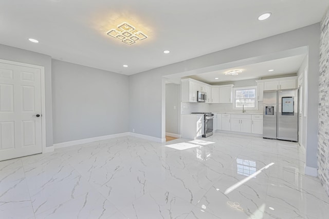 52 State St, Valley Stream, NY 11580 - unfurnished living room with baseboards, light marble finish floors, and recessed lighting