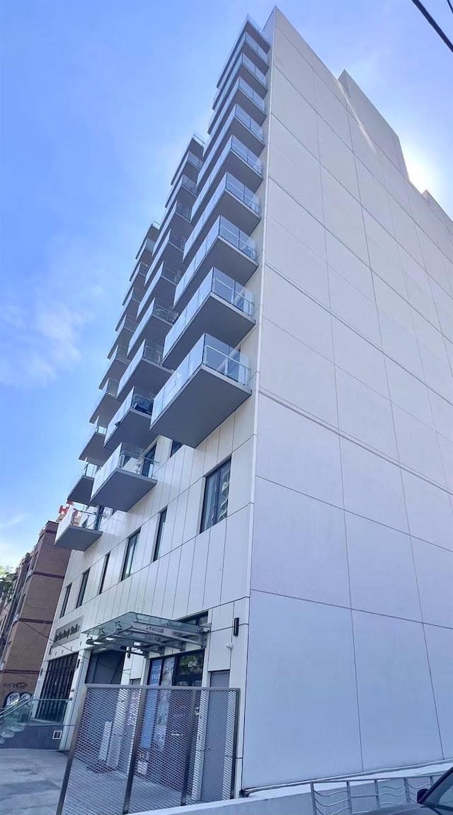 view of building exterior featuring fence