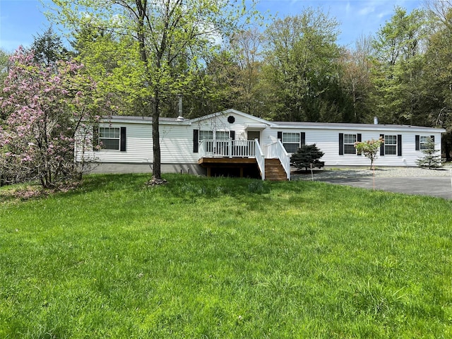265 Old Tacy Rd Unit Tr95, Swan Lake, NY 12783 - manufactured / mobile home with a deck and a front lawn