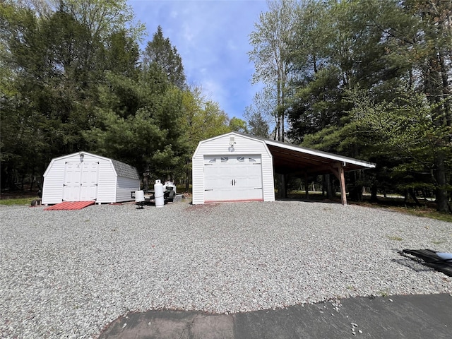 265 Old Tacy Rd Unit Tr95, Swan Lake, NY 12783 - garage featuring a garage, a shed, and gravel driveway