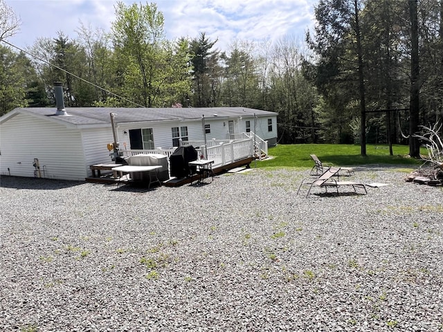 265 Old Tacy Rd Unit Tr95, Swan Lake, NY 12783 - back of property featuring a wooden deck and a yard