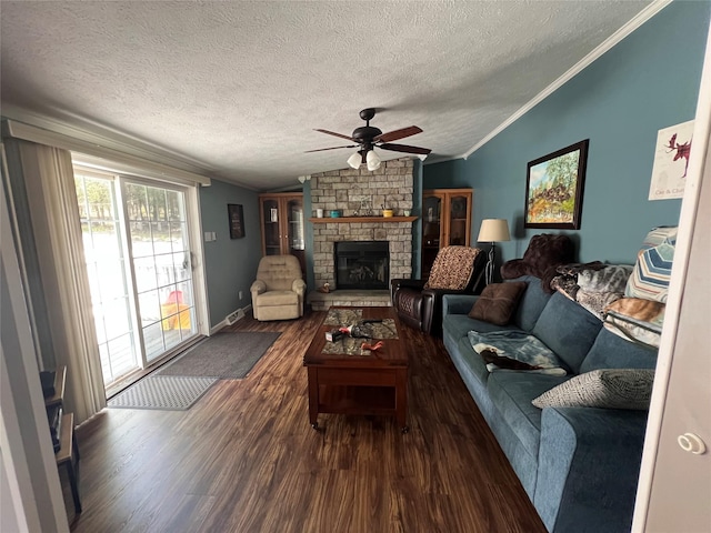 265 Old Tacy Rd Unit Tr95, Swan Lake, NY 12783 - living area with vaulted ceiling, dark wood-style flooring, ceiling fan, a stone fireplace, and a textured ceiling
