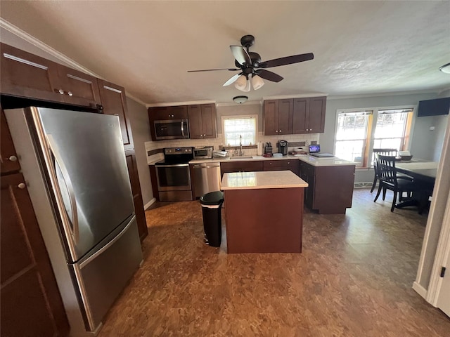 265 Old Tacy Rd Unit Tr95, Swan Lake, NY 12783 - kitchen featuring stainless steel appliances, a sink, a peninsula, light countertops, and a ceiling fan