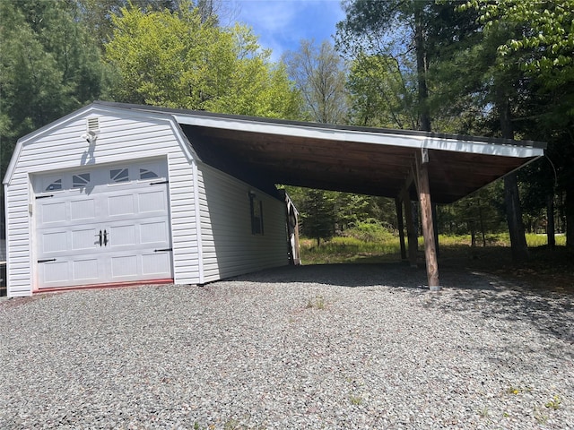 265 Old Tacy Rd Unit Tr95, Swan Lake, NY 12783 - view of parking / parking lot featuring driveway, a carport, and a garage