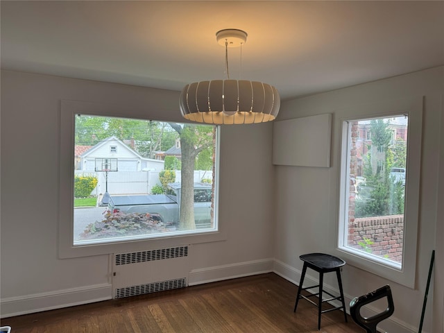163-18 Cryders Ln, Whitestone, NY 11357 - unfurnished dining area featuring radiator and wood finished floors