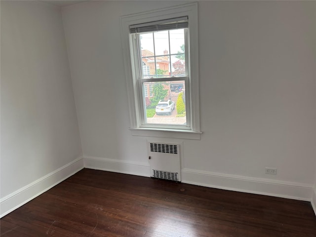 163-18 Cryders Ln, Whitestone, NY 11357 - unfurnished room with radiator and dark wood finished floors