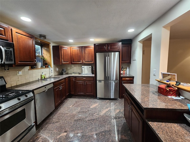 79 N Broadway Unit H, White Plains, NY 10603 - kitchen featuring appliances with stainless steel finishes, a sink, tasteful backsplash, recessed lighting, and granite tiled floors