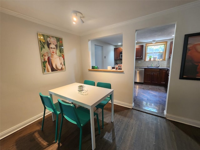 79 N Broadway Unit H, White Plains, NY 10603 - dining area featuring baseboards, crown molding, and dark wood-style floors