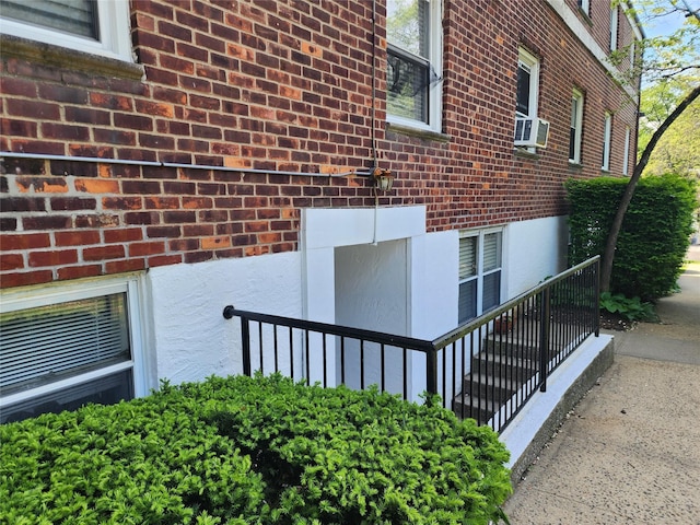 79 N Broadway Unit H, White Plains, NY 10603 - view of home's exterior with brick siding and cooling unit
