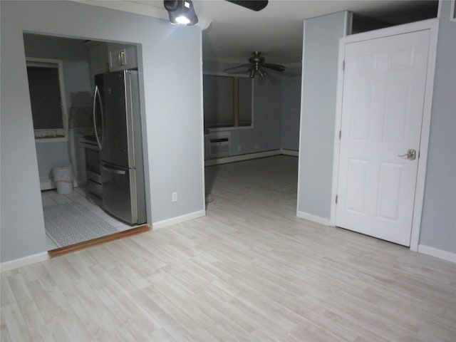 unfurnished bedroom with freestanding refrigerator, light wood-type flooring, baseboards, and ceiling fan