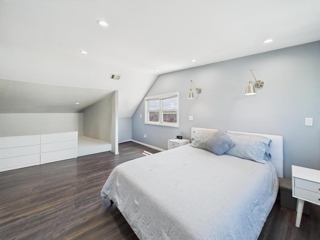 bedroom featuring wood finished floors, vaulted ceiling, recessed lighting, and baseboards