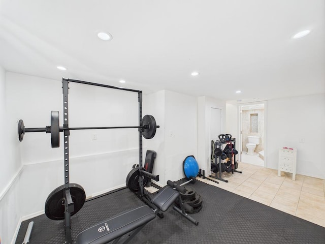 workout room featuring recessed lighting and tile patterned flooring