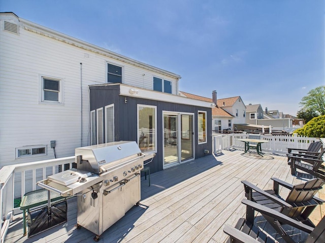 wooden deck featuring outdoor dining area
