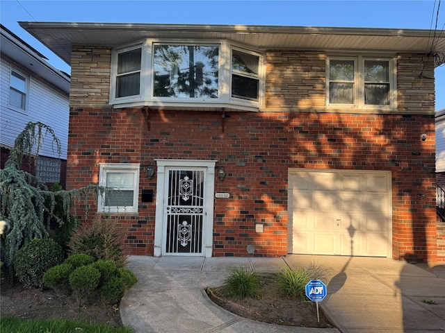 163-33 90th St, Howard Beach, NY 11414 - view of front of property with an attached garage, driveway, and brick siding
