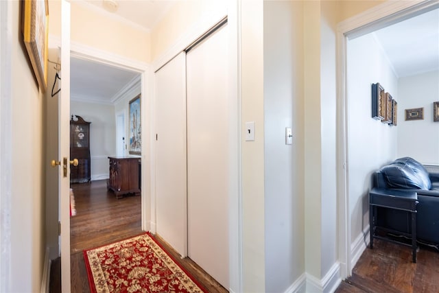 hall with crown molding and wood finished floors